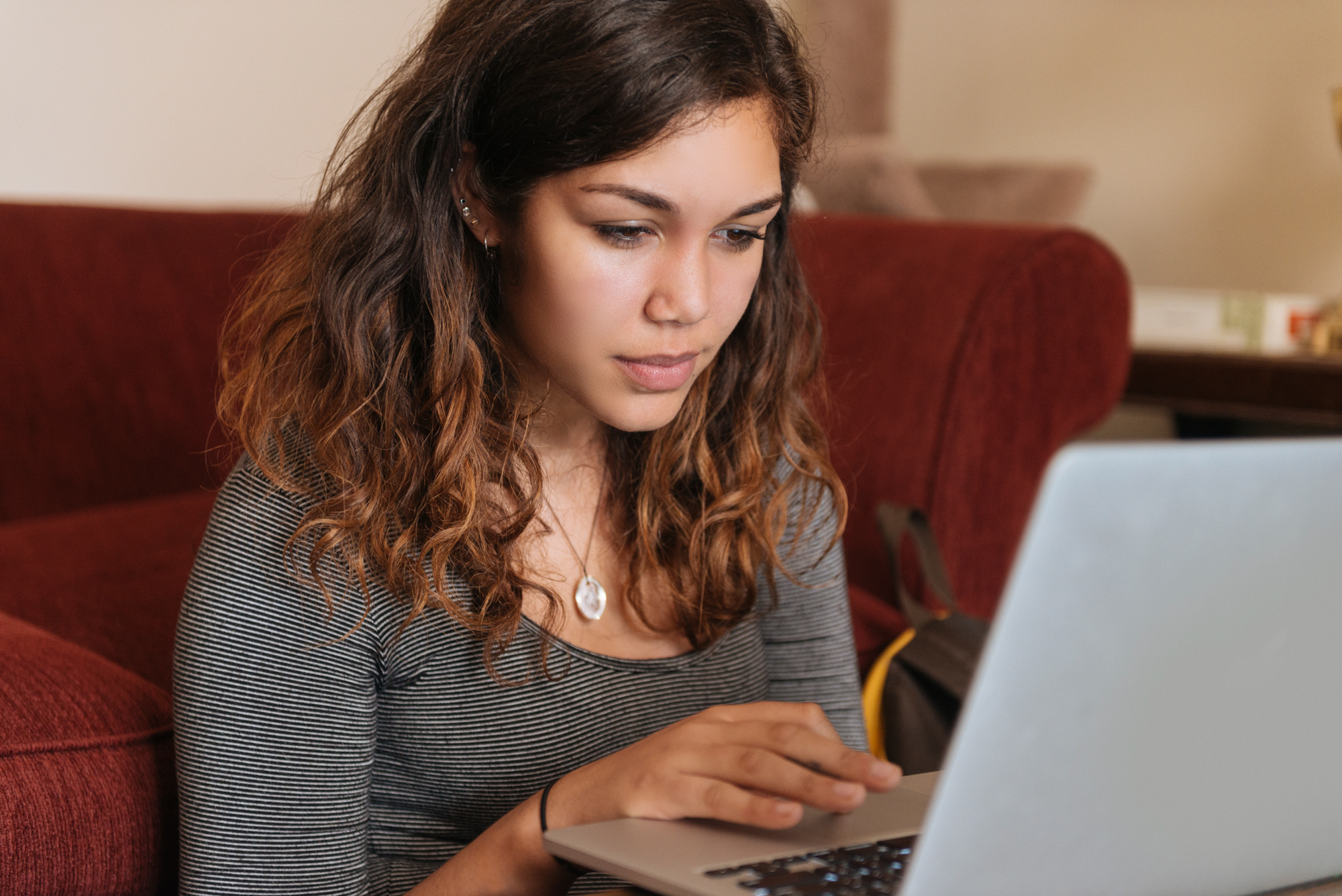 Young Woman Studies On Computer at Home for Higher Education